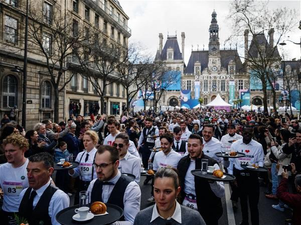 Waiters and waitresses race through streets of Paris for first time in 13 years ahead of Olympics